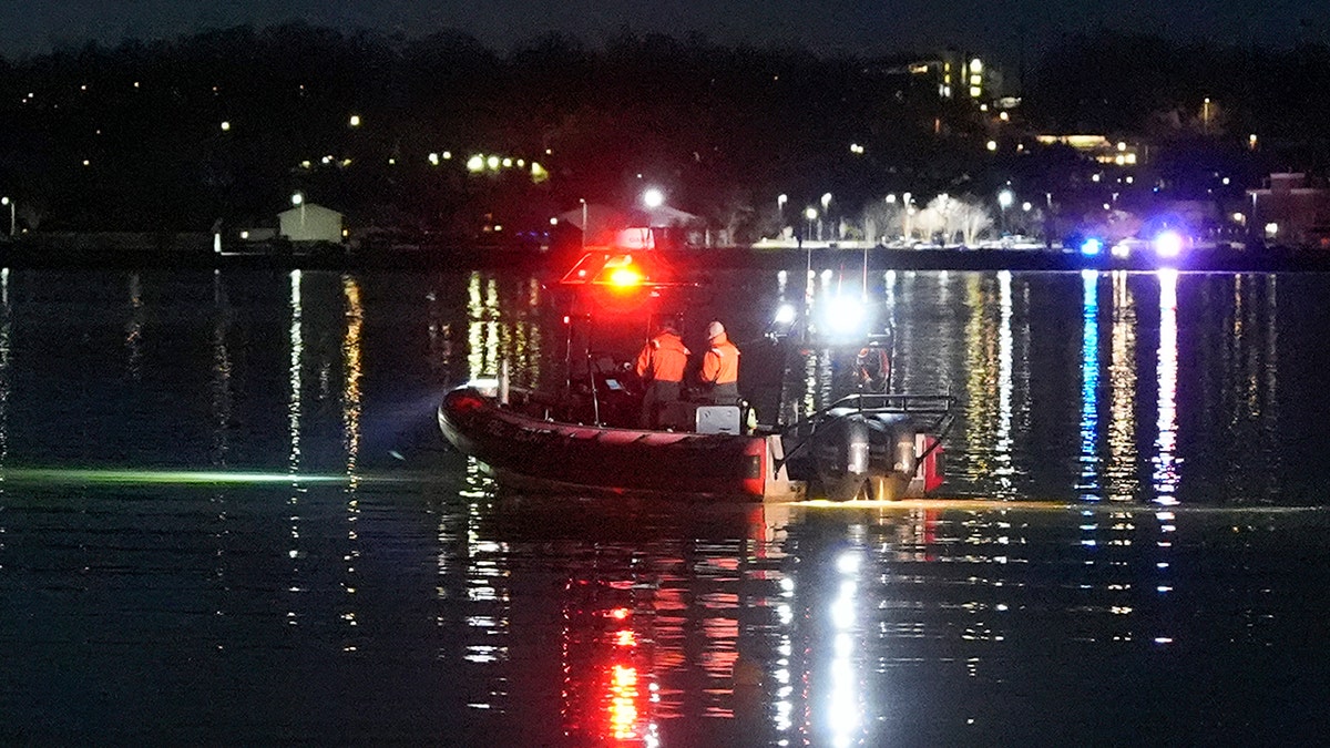 Rescuers work on the Potomac River in Washington DC after a tragic plane crash