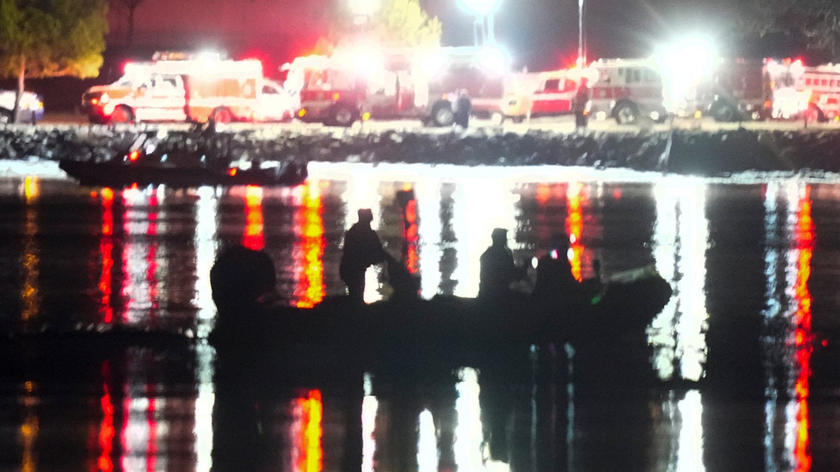 Rescuers work on the Potomac River in Washington DC after a tragic plane crash