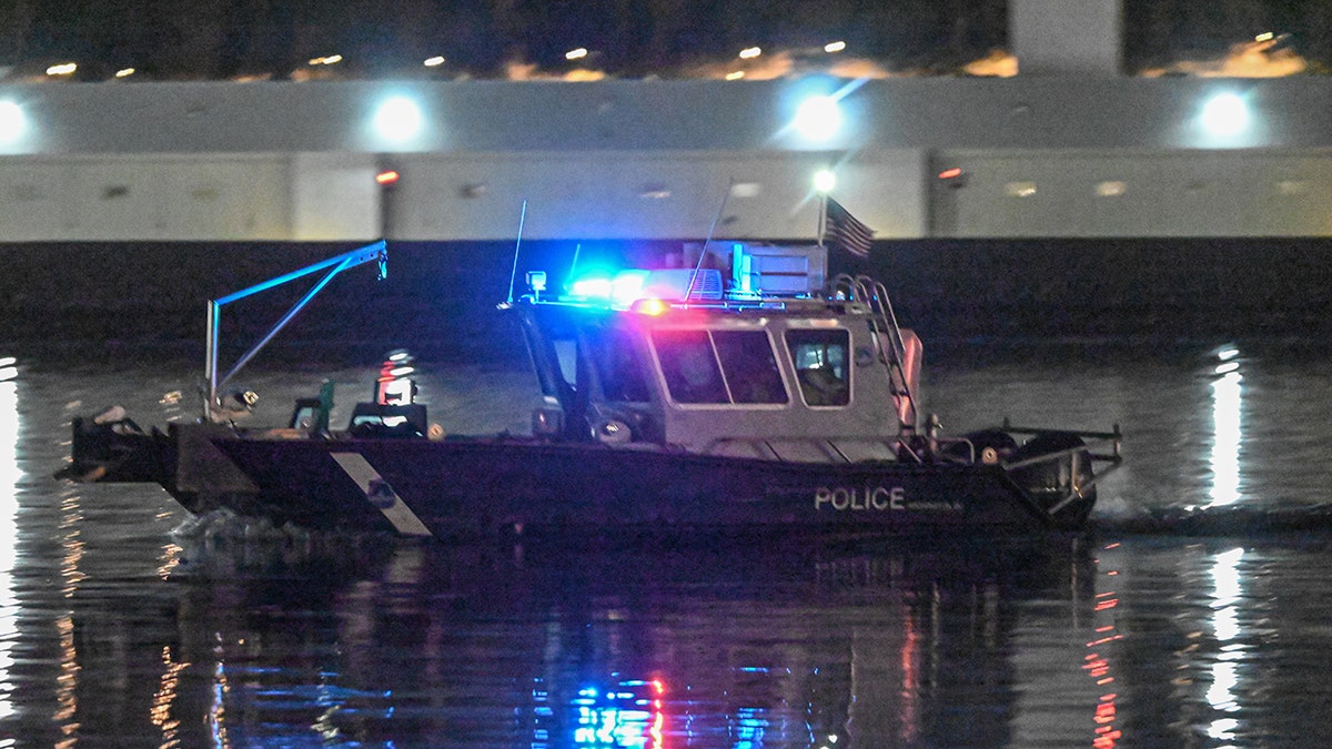 Rescuers work on the Potomac River in Washington DC after a tragic plane crash