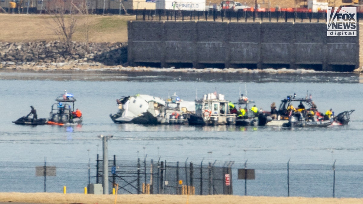 An American Airlines Jet and the United States Search Efforts in DC after a collision between the Black Sahin helicopter