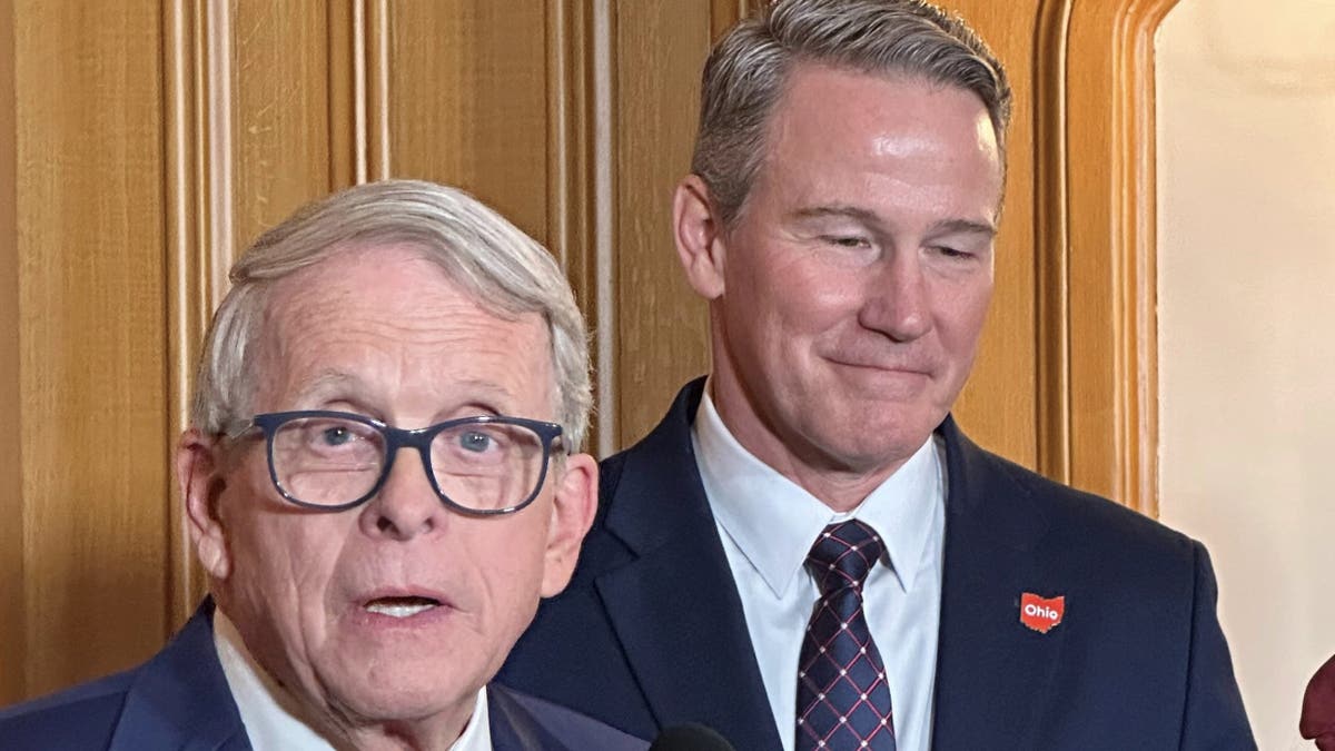 Republican Ohio Gov. Mike DeWine speaks at a news conference on Friday, Jan. 17, 2025, in Columbus, Ohio, announcing his appointment of Lt. Gov. Jon Husted, right, to fill the U.S. Senate seat formerly held by Vice President-elect JD Vance. (AP Photo/Julie Carr Smyth)