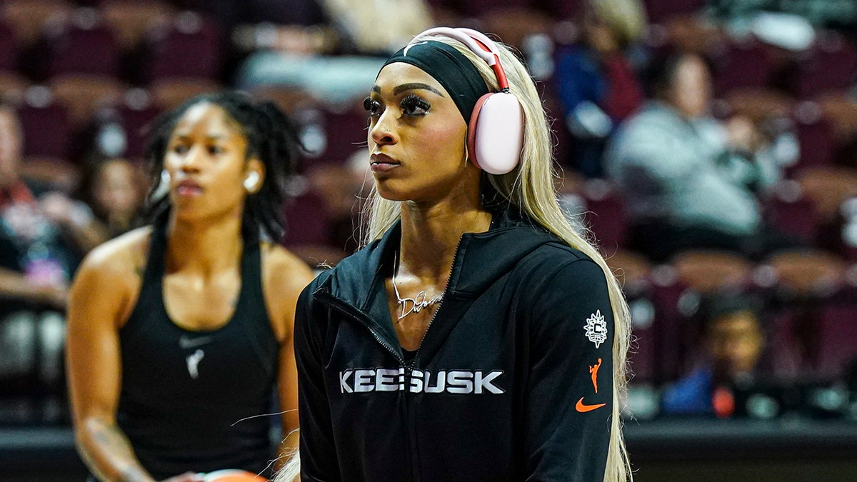 Connecticut Sun guard DiJonai Carrington, #21, and guard Tyasha Harris, #52, warm up before the start of game four of the 2024 WNBA Semi-finals against the Minnesota Lynx at Mohegan Sun Arena in Uncasville, Connecticut, on Oct. 6, 2024.