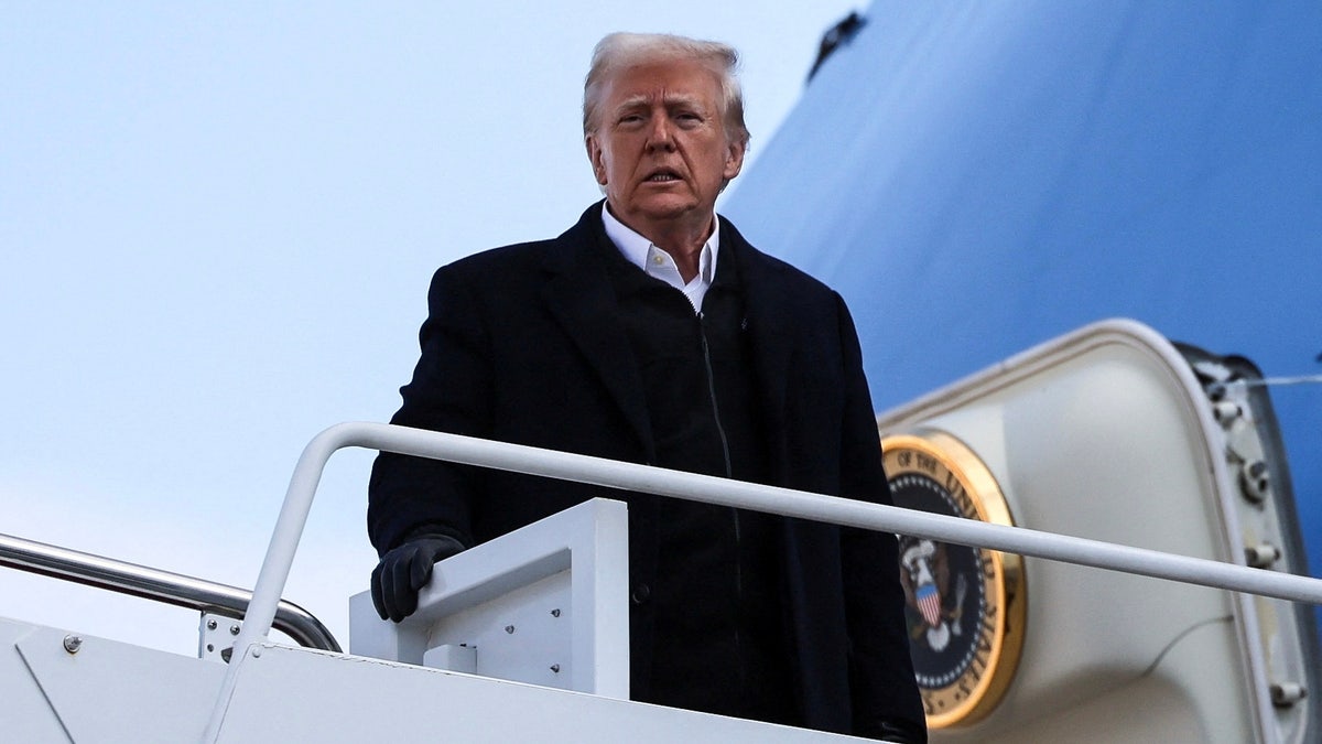 President Trump atop steps to Air Force One