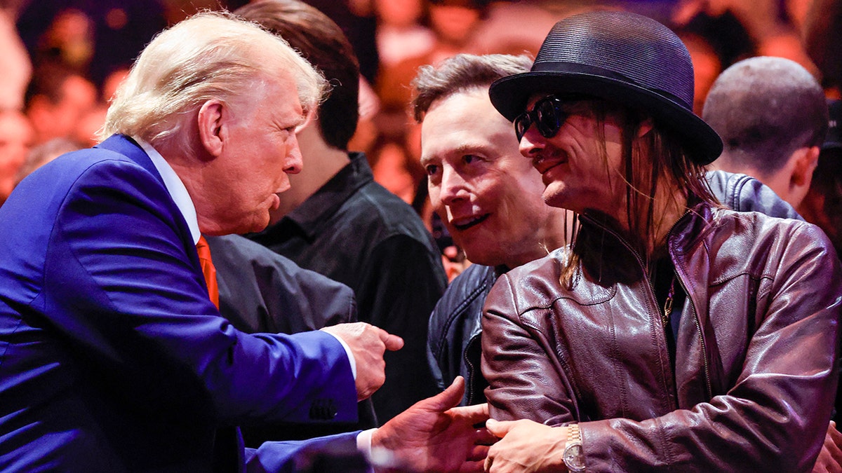 President Trump wears a blue suit and red tie, Elon Musk wears a leather jacket, and Kid Rock wears a leather jacket and hat at a UFC fight in New York City