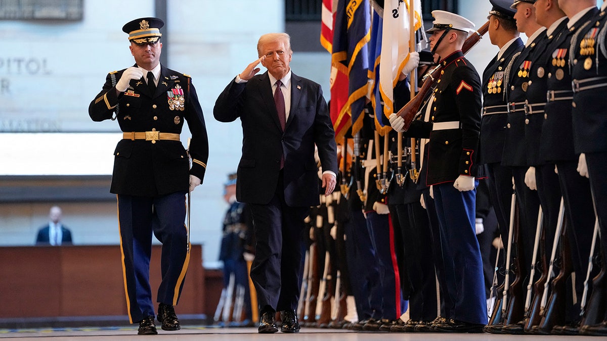 Donald Trump salutes troops as he reviews them