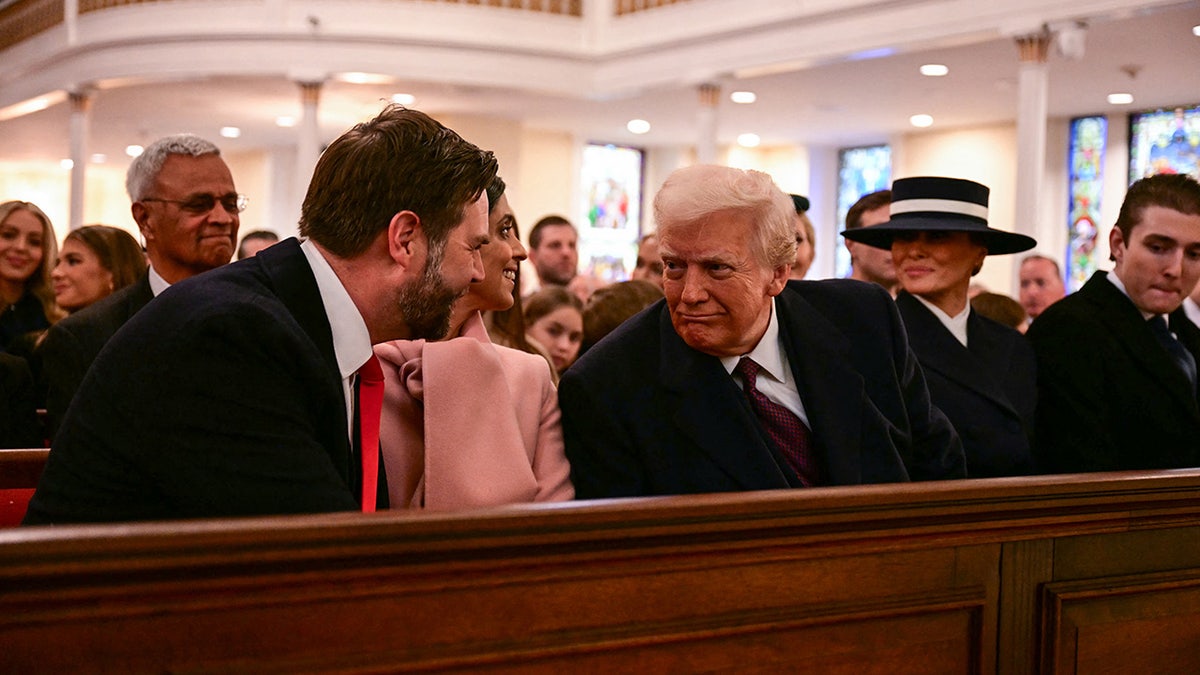 The President of the United States -elect Donald Trump speaks with Vice President -elect JD Vance during the church service in the Church of Saint John Episcopal