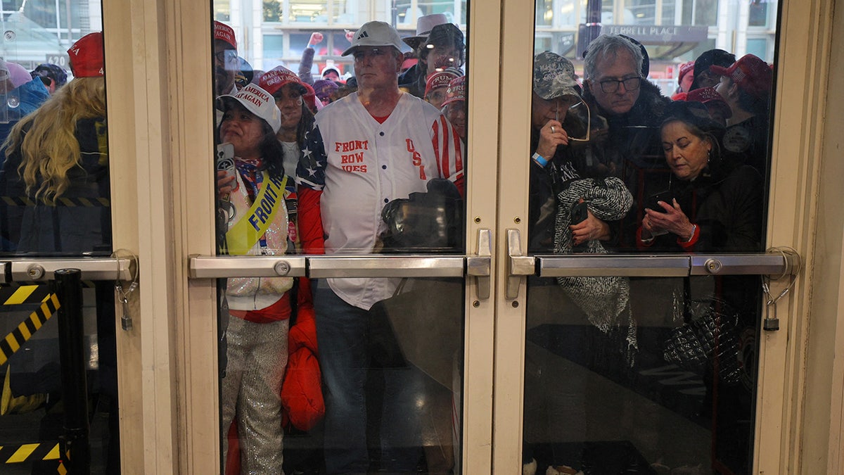 Supporters hold   to participate  the venue up  of a U.S. President-elect Donald Trump rally