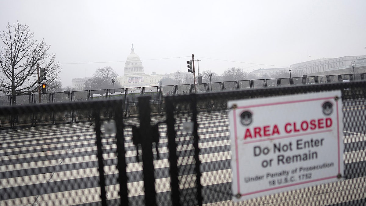 Fencing with the US Capitol on a foggy day