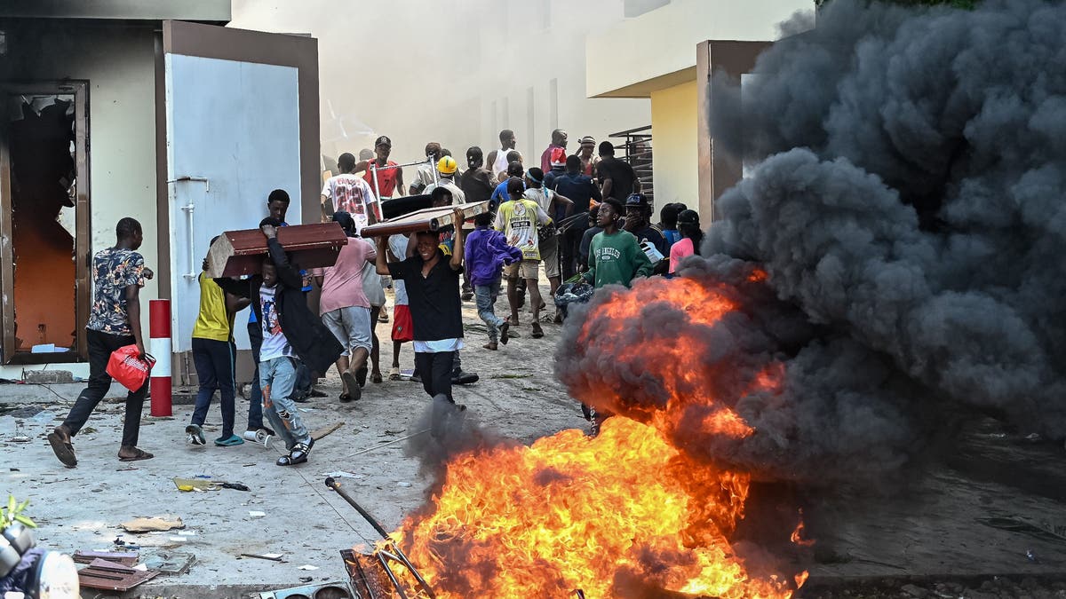 March 23 Movement (M23) rebels gather for large-scale protests as they set on fire the Rwandan, French, Belgian and Kenyan embassy buildings and loot some shopping centers during anti-Rwandan demonstrations allegedly supported by M23 and rebels in Kinshasa, the capital of the Democratic Republic of Congo on Jan. 28, 2025.