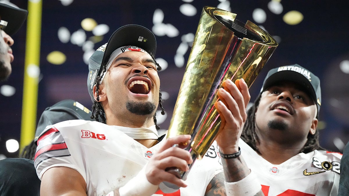 Emeka Egbuka with title  trophy