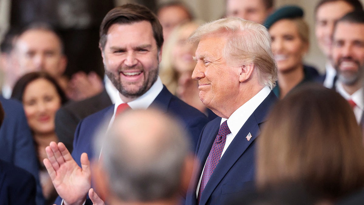 U.S. Vice President-elect J.D. Vance applauds as U.S. President-elect Donald Trump reacts on the day of his Presidential Inauguration