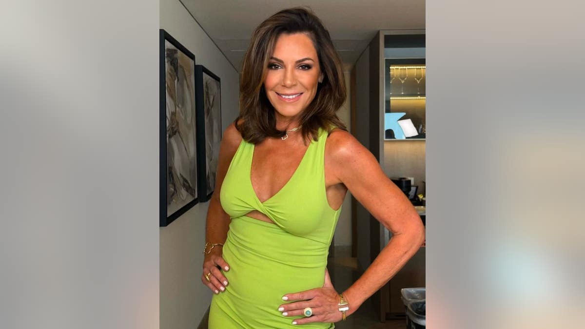 luann de lesseps smiling in a green top