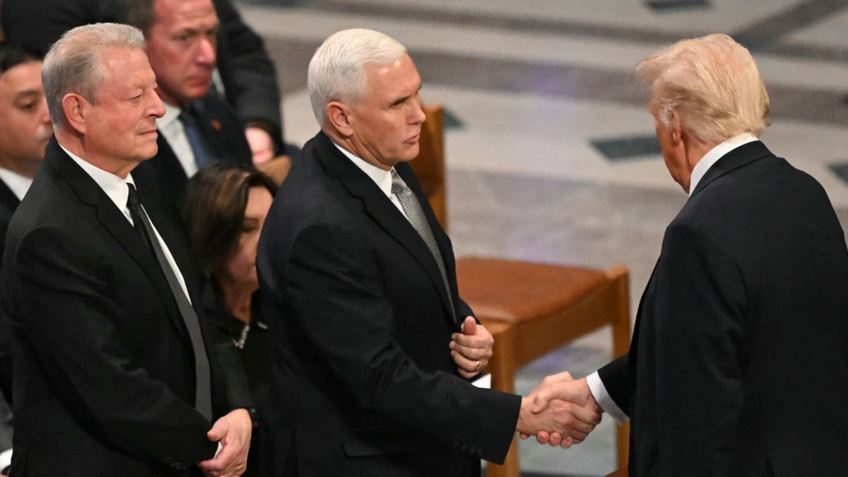 Pence and Trump shake hands at funeral