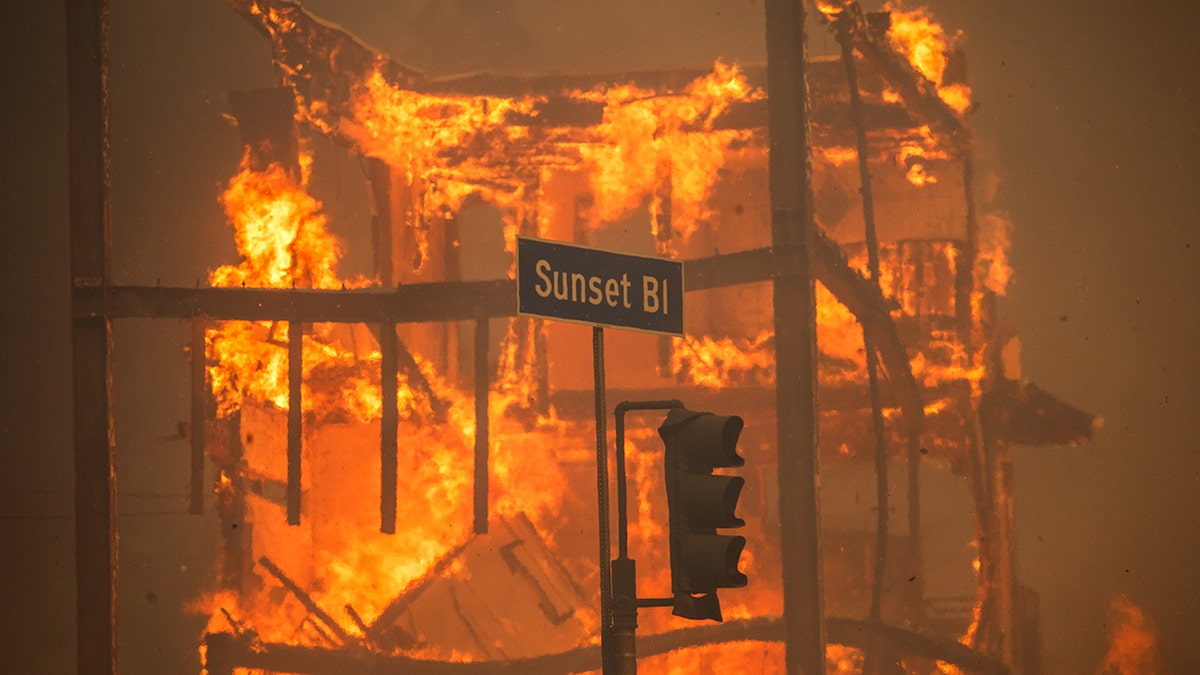 Fire anger around the Palisade Sunset Blvd Street sign