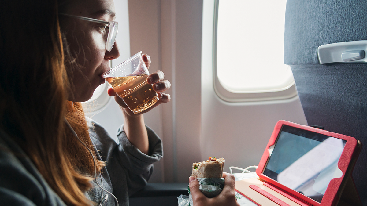 drinking flight passenger