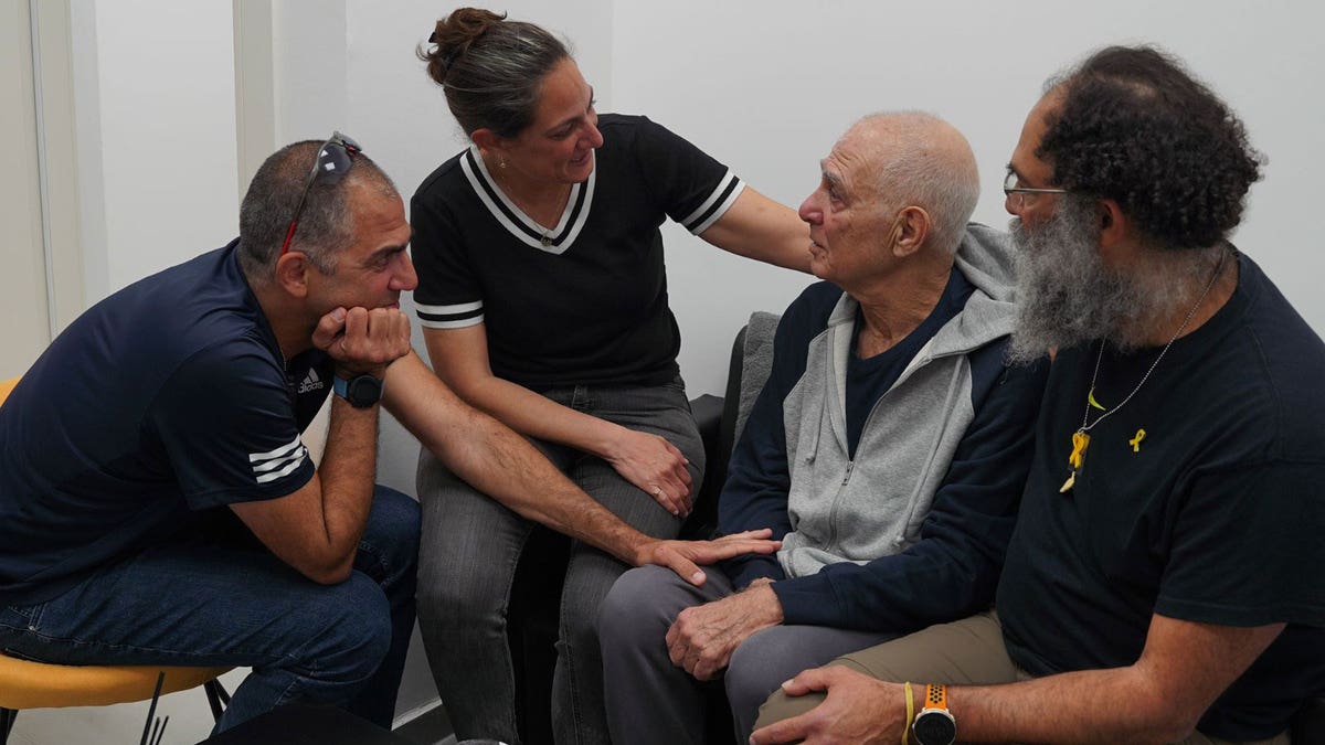 Released hostage Gadi Moses seen with his family at the Reim Military base near the Israel-Gaza border.
