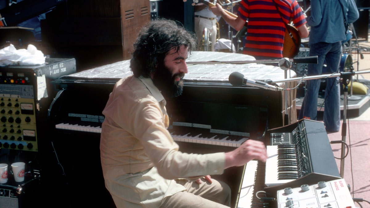 Richard Manuel plays the keyboard