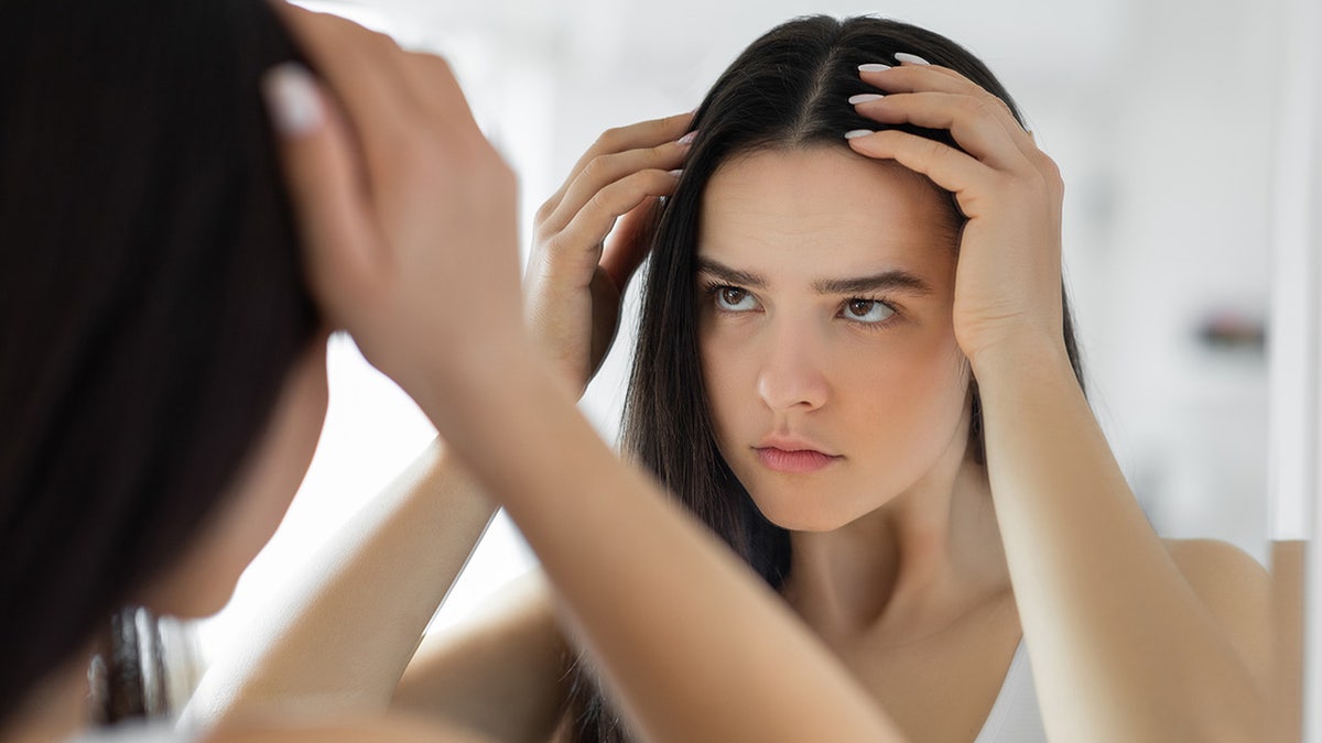 Woman having problem with hair loss