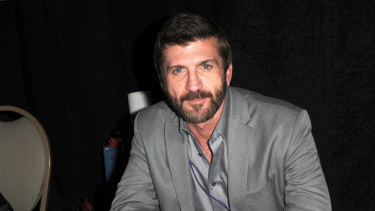 Joe Lando smiles