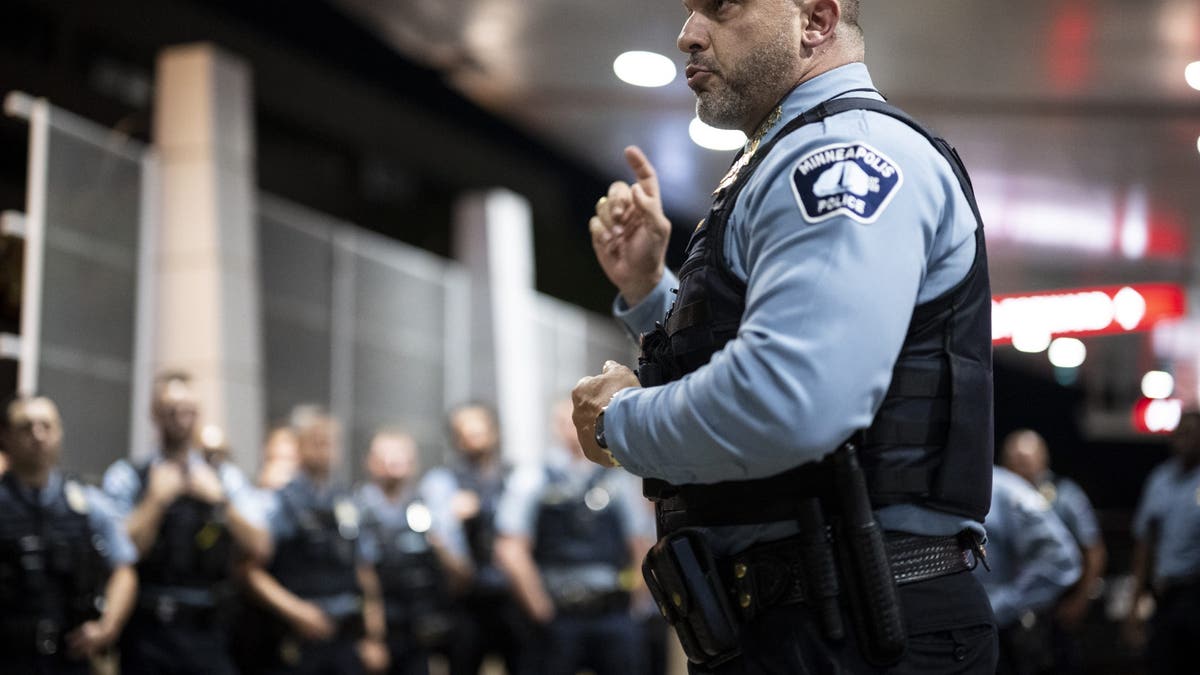 Minneapolis Police Chief Brian OHara addresses more than 100 uniformed law enforcement officers while waiting for the release of an officer who was shot in the line of duty in north Minneapolis, Saturday, Aug. 12, 2023.