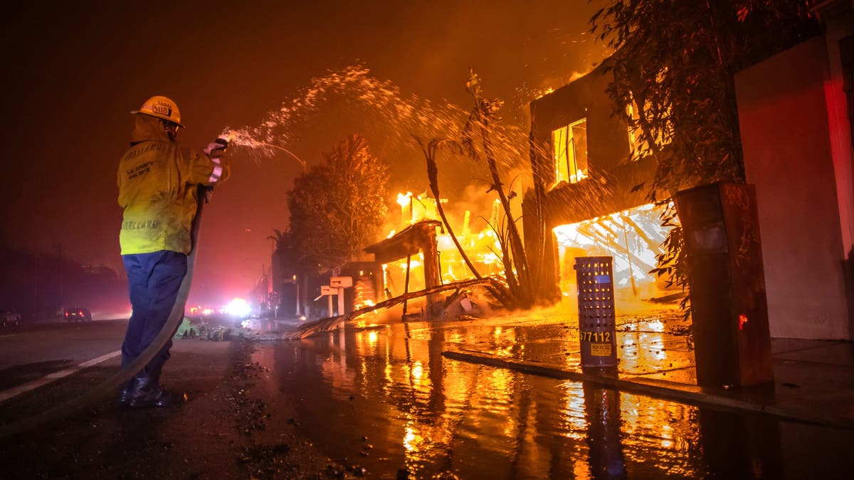 Firefighter battles the Palisades Fire