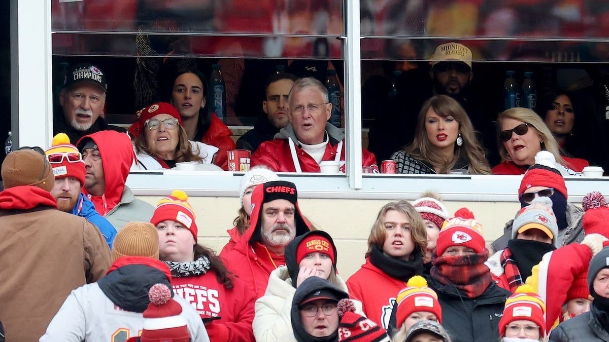 Singer-songwriter Taylor Swift looks back at halftime of the playoff game between the Houston Texans and Kansas City Chiefs at JHA at Arrowhead Stadium on January 18, 2025 in Kansas City, Missouri.