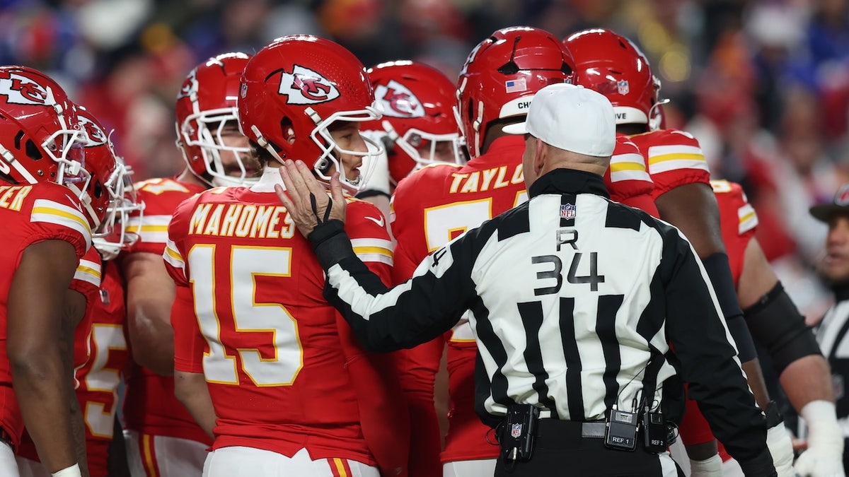 Referee Carl Cheffers puts his hand on the back of Kansas City Chiefs quarterback Patrick Mahomes, #15, in the first quarter of the AFC Championship game between the Buffalo Bills and Kansas City Chiefs on Jan. 26, 2025 at GEHA Field at Arrowhead Stadium in Kansas City, Missouri.