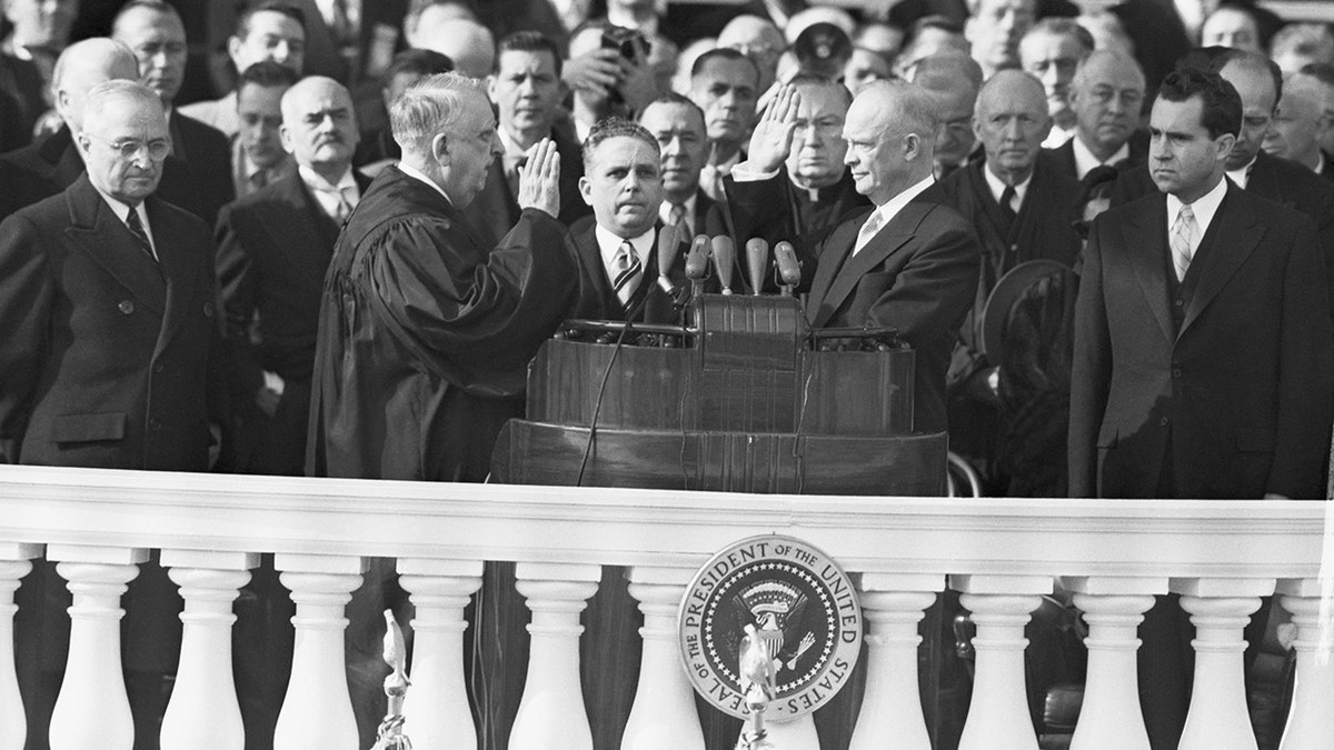 Dwight Eisenhower (center right) is sworn in by Chief Justice Fred Moore Vinson (center left). On the far left is outgoing President Harry Truman, and on the far right is incoming Vice President Richard Nixon.