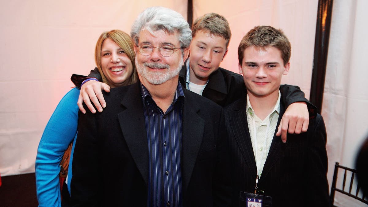 Star Wars director George Lucas, Amanda Lucas, Jett Lucas and Jake Lloyd attend the after party for the San Francisco World Premiere of Star Wars: Episode III Revenge of the Sith at Loews Theatres.