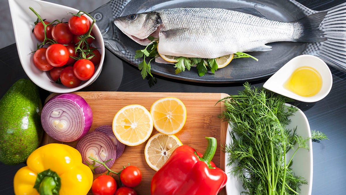 Fish with lemon, vegetables, olive oil, vanilla and spices