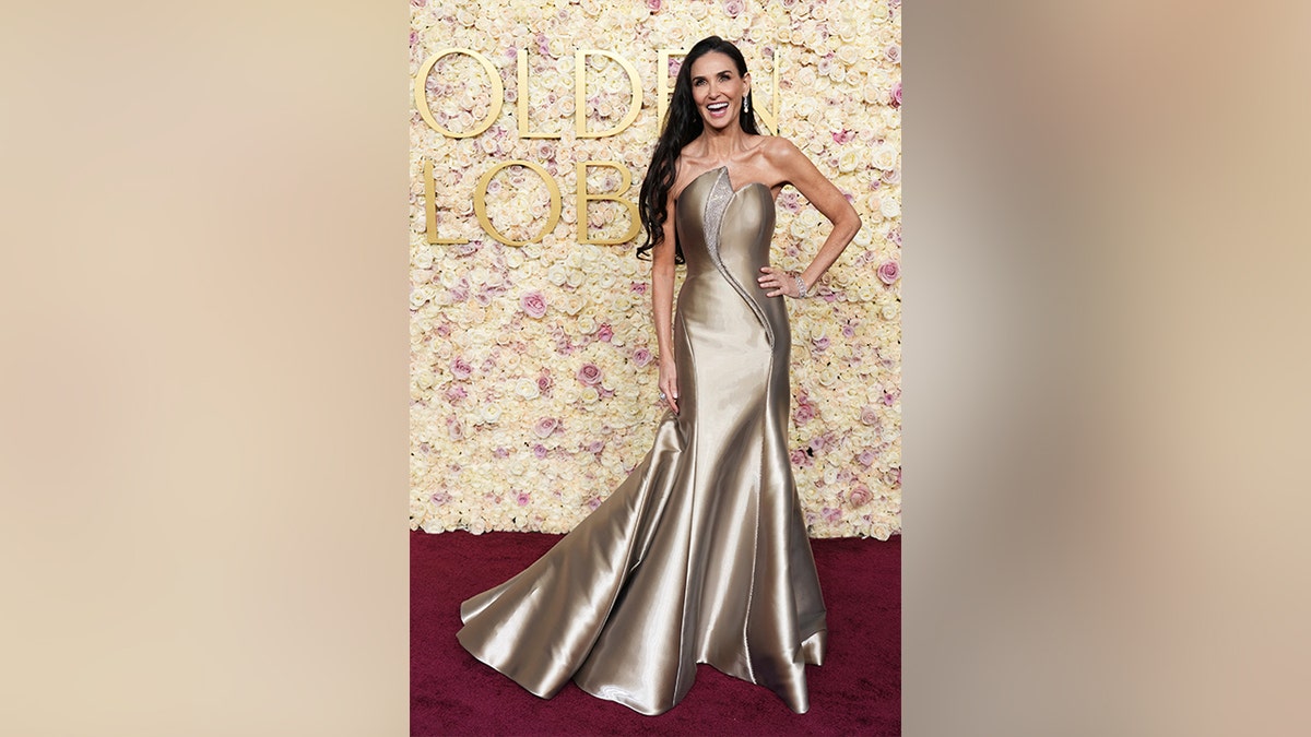 Demi Moore laughs on Golden Globes red carpet