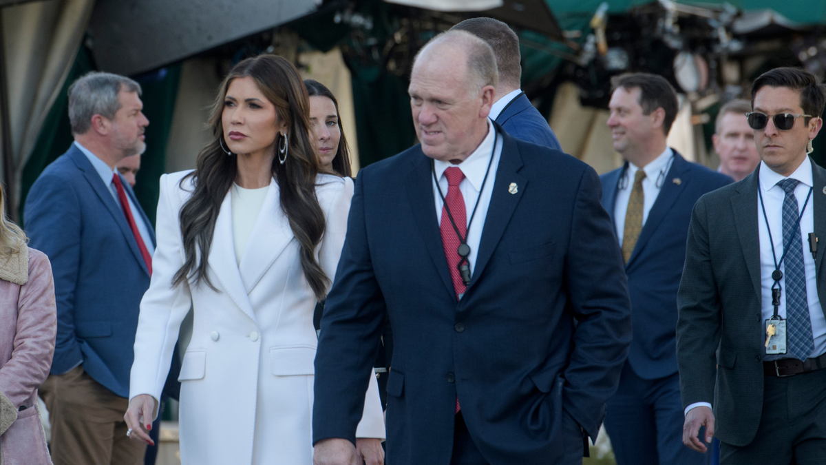 Homeland Security Secretary Kristi Noem, left, and White House border czar Tom Homan walk across the White House grounds on Wednesday, Jan. 29, 2025.