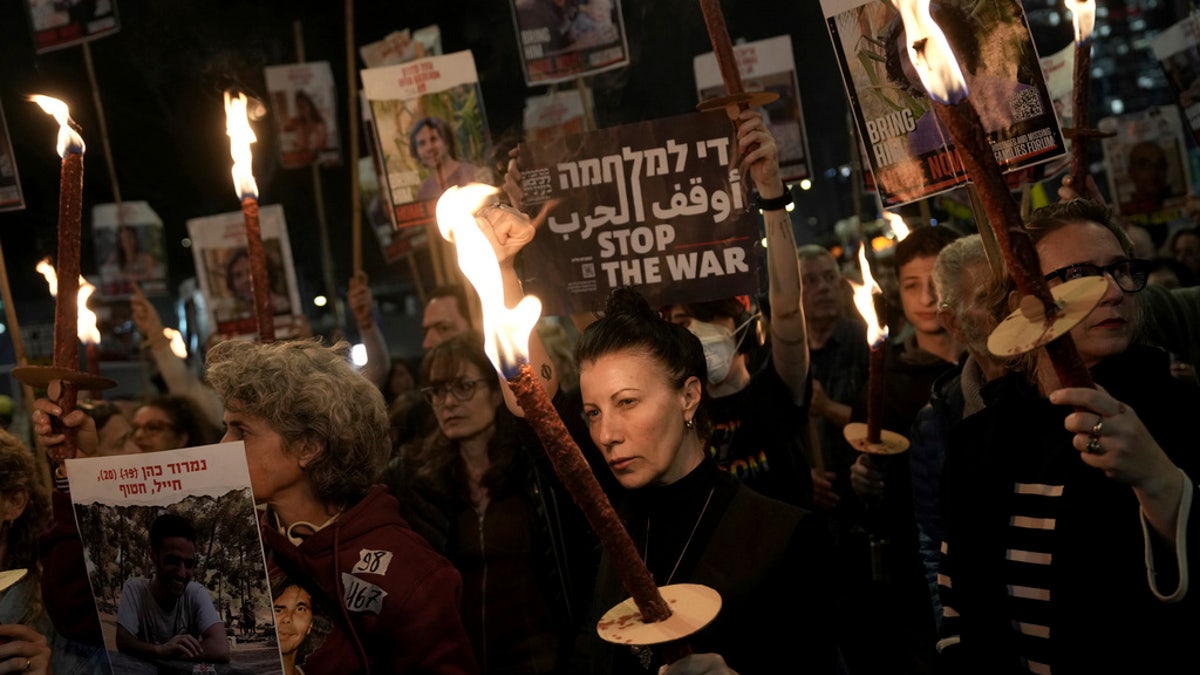 Relatives and friends of people killed and abducted by Hamas and taken into Gaza react to the ceasefire announcement as they take part in a demonstration in Tel Aviv, Israel, on Wednesday.