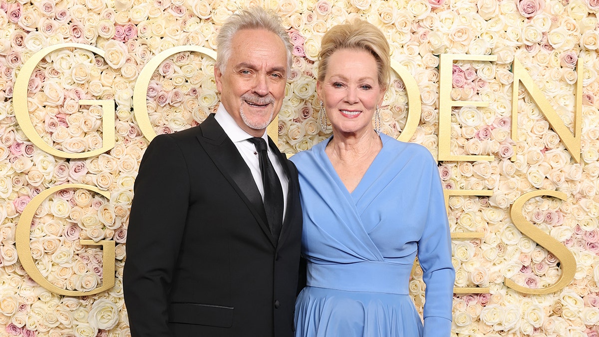 Hacks star Jean Smart wears a blue dress at the Golden Globes with Joe Pacheco