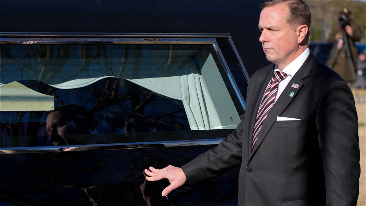 Secret Service agent with Carter hearse