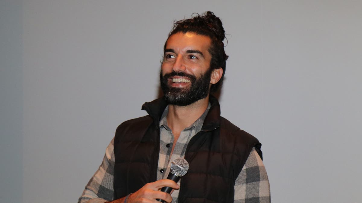 Justin Baldoni with a man bun