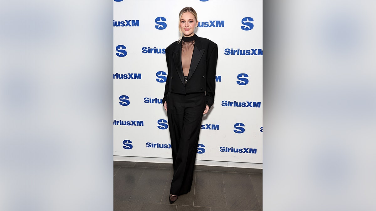 Ballerini wore a sheer apical  and trousers erstwhile   visiting the SiriusXM studios.