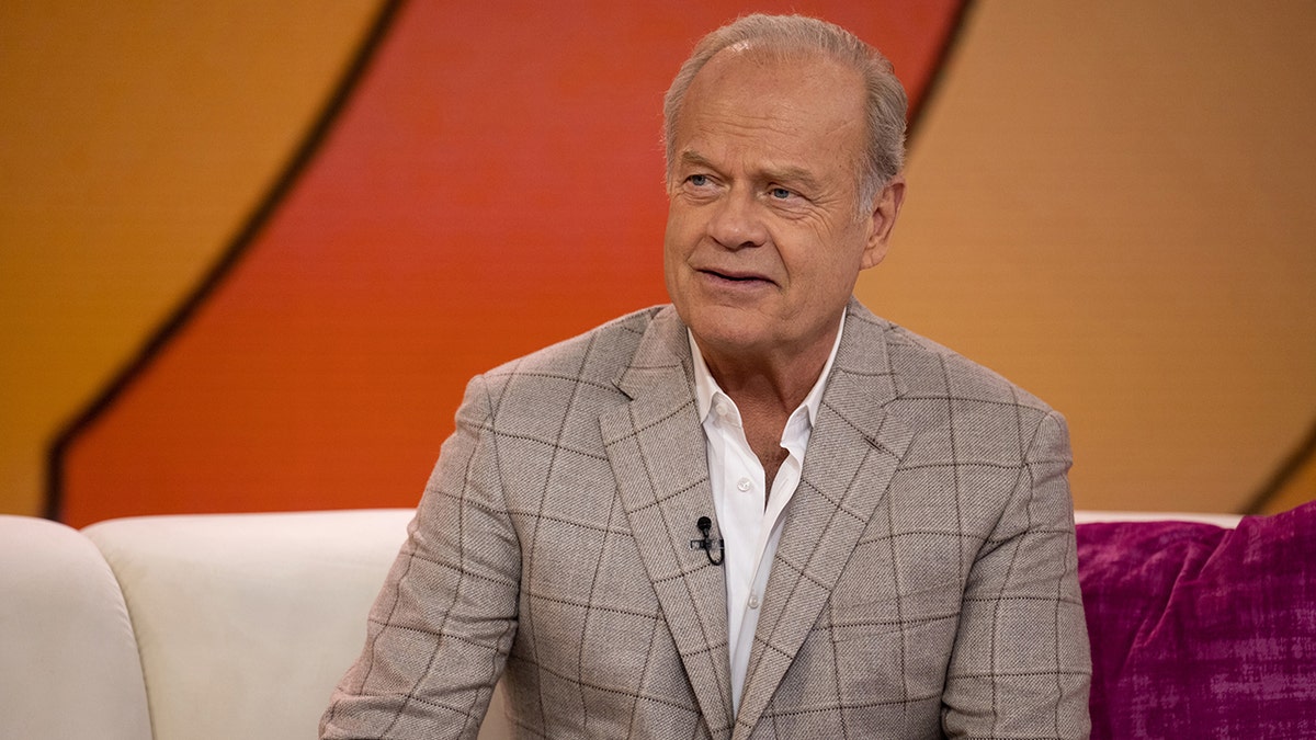 Kelsey Grammer sitting on a couch