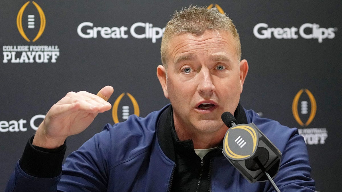 Kirk Herbstreit speaks to the media