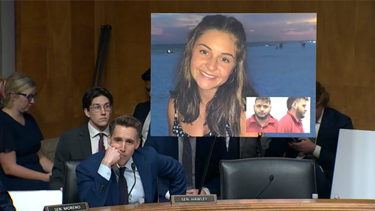 Senator Josh Hawley (R-MO) with a photo of Lakin Riley behind him