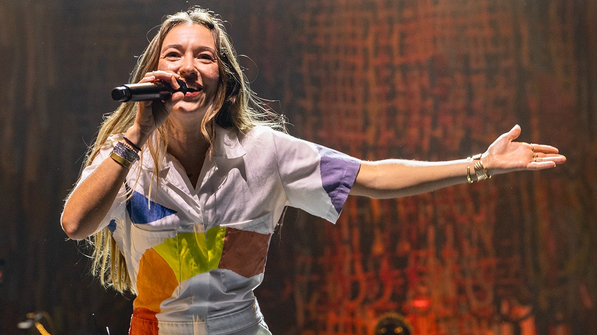 Lauren Daigle acting on stage in Melbourne.