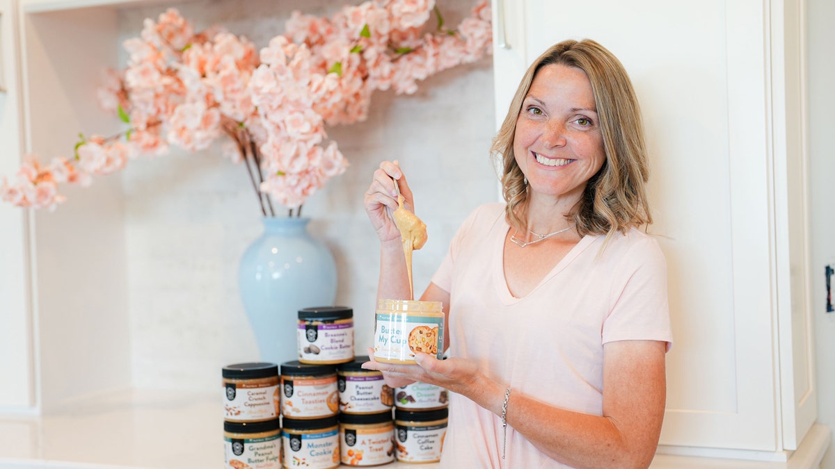 Leah Hurley, founder and CEO of American Dream Nut Butter, holds a spoonful of one of her nut butters.