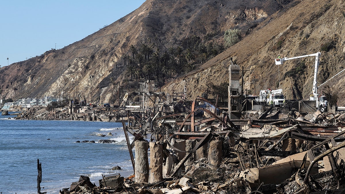 Workers replace power line following the Palisades Fire