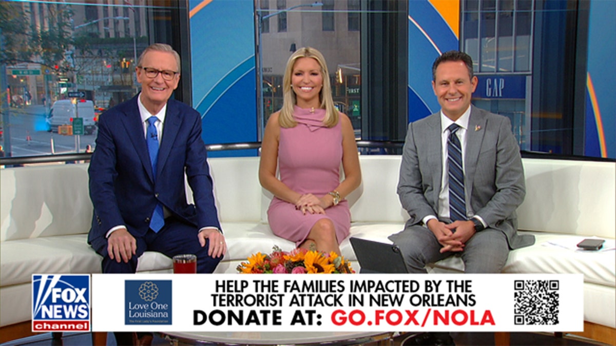 Fox and Friends hosts sitting on couch smiling