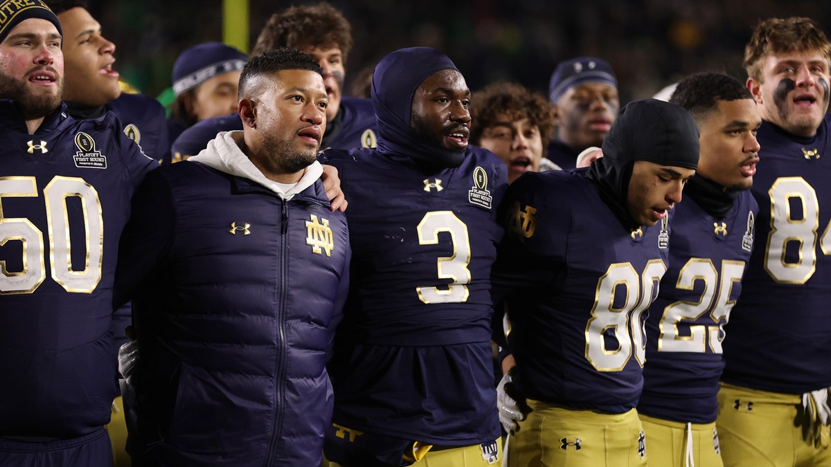 Notre Dame football coach Marcus Freeman celebrates with his players after their home win against Indiana.