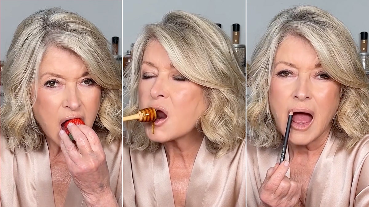 Martha Stewart in the beige silk robe strawberry bites, division absorbs honey off the split of honey applies lipstick with her mouth Agape