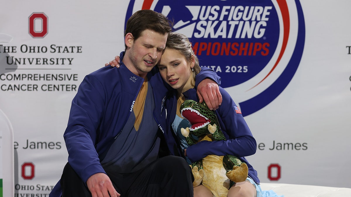 Misha Metrovanov and Alyssa Efimova embrace