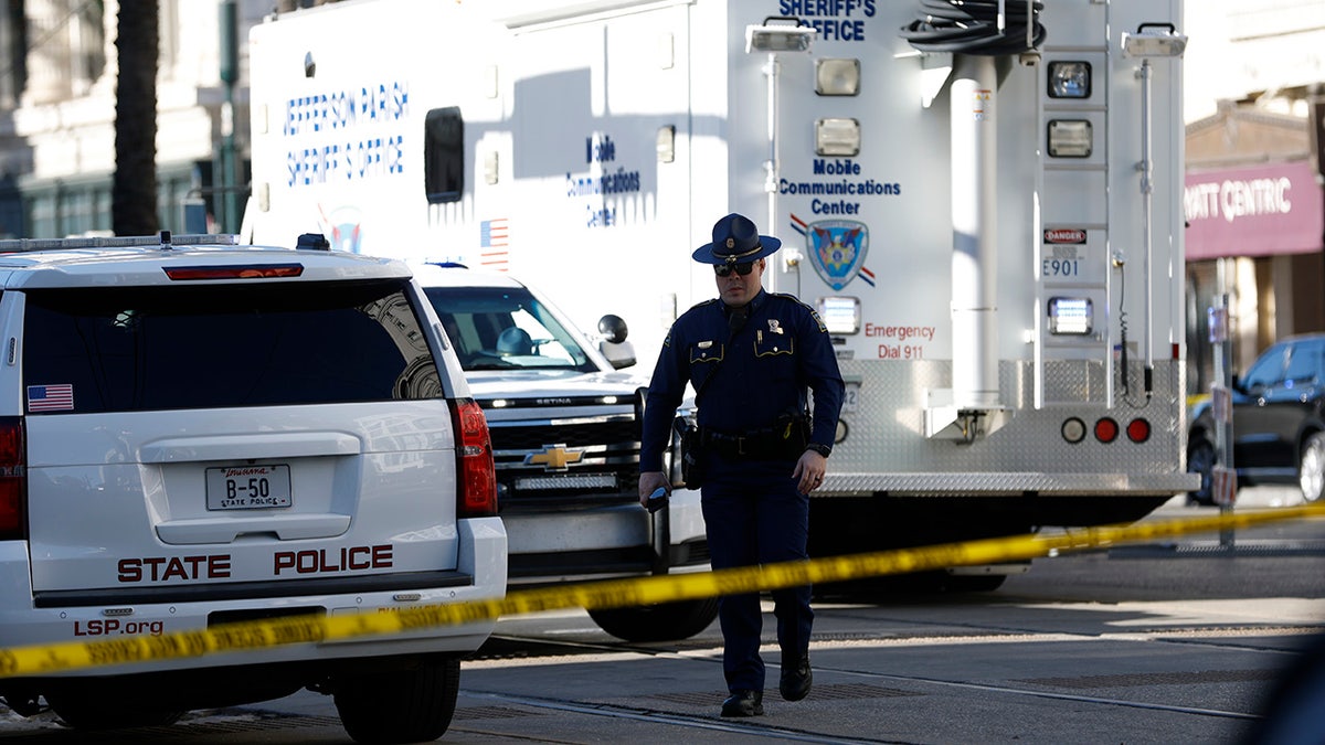 The police walk past the crime scene