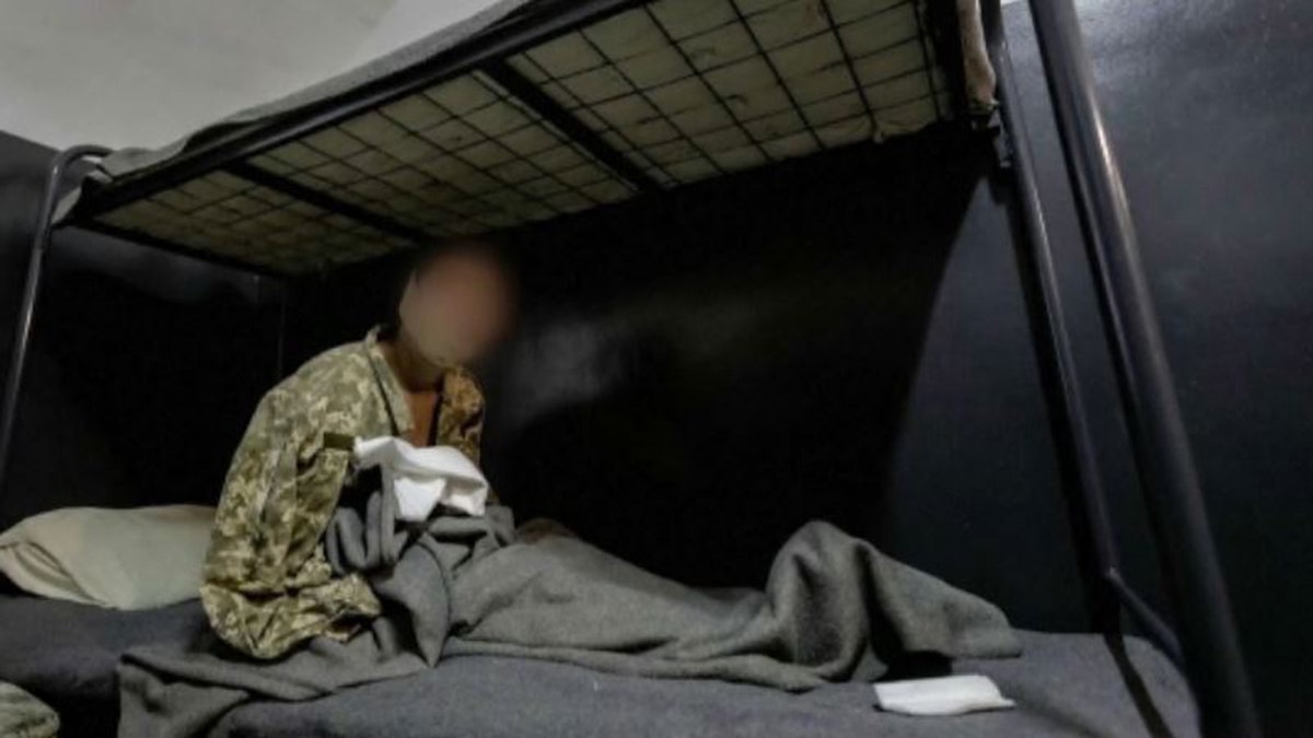 North Korean soldier in Russia resorts to suicide during first prisoner of war held by Ukraine 9 North Korean soldier sitting on bed