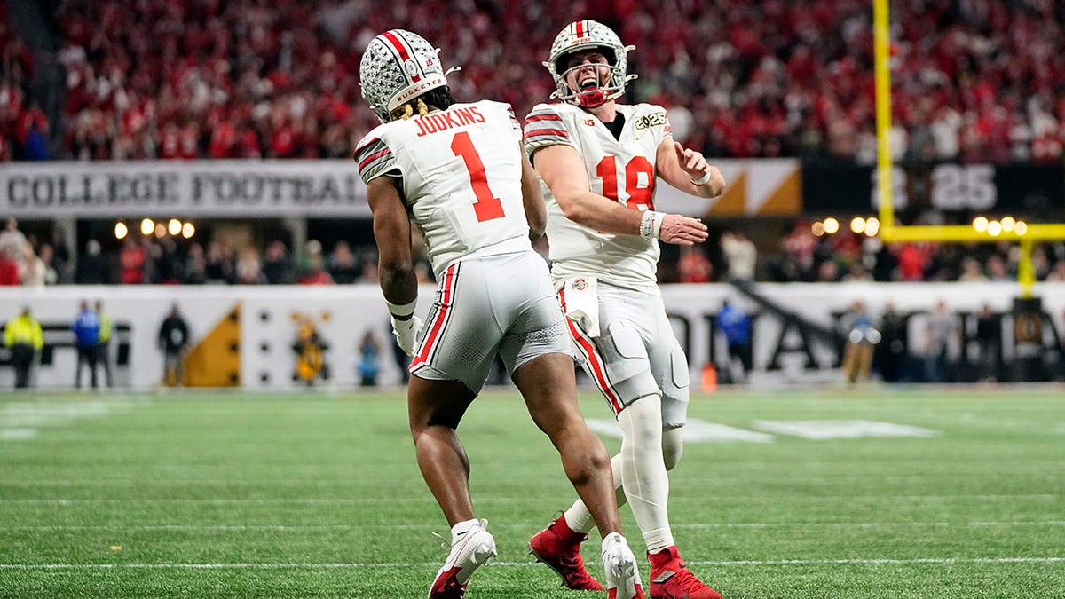 Quinshon Judkins celebrates a touchdown with Will Howard